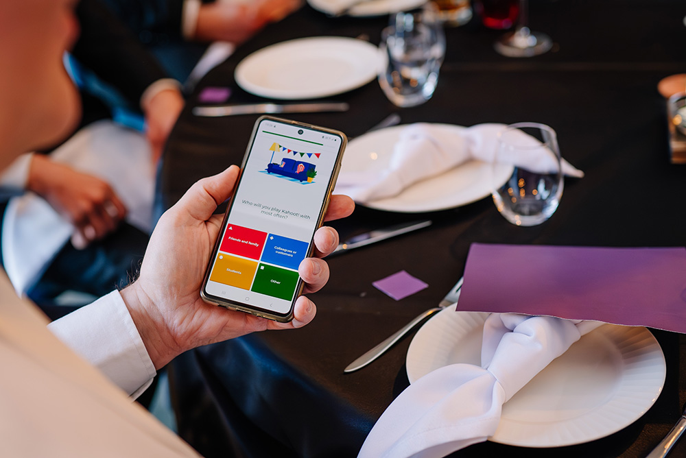 mobile phone showing trivia questions